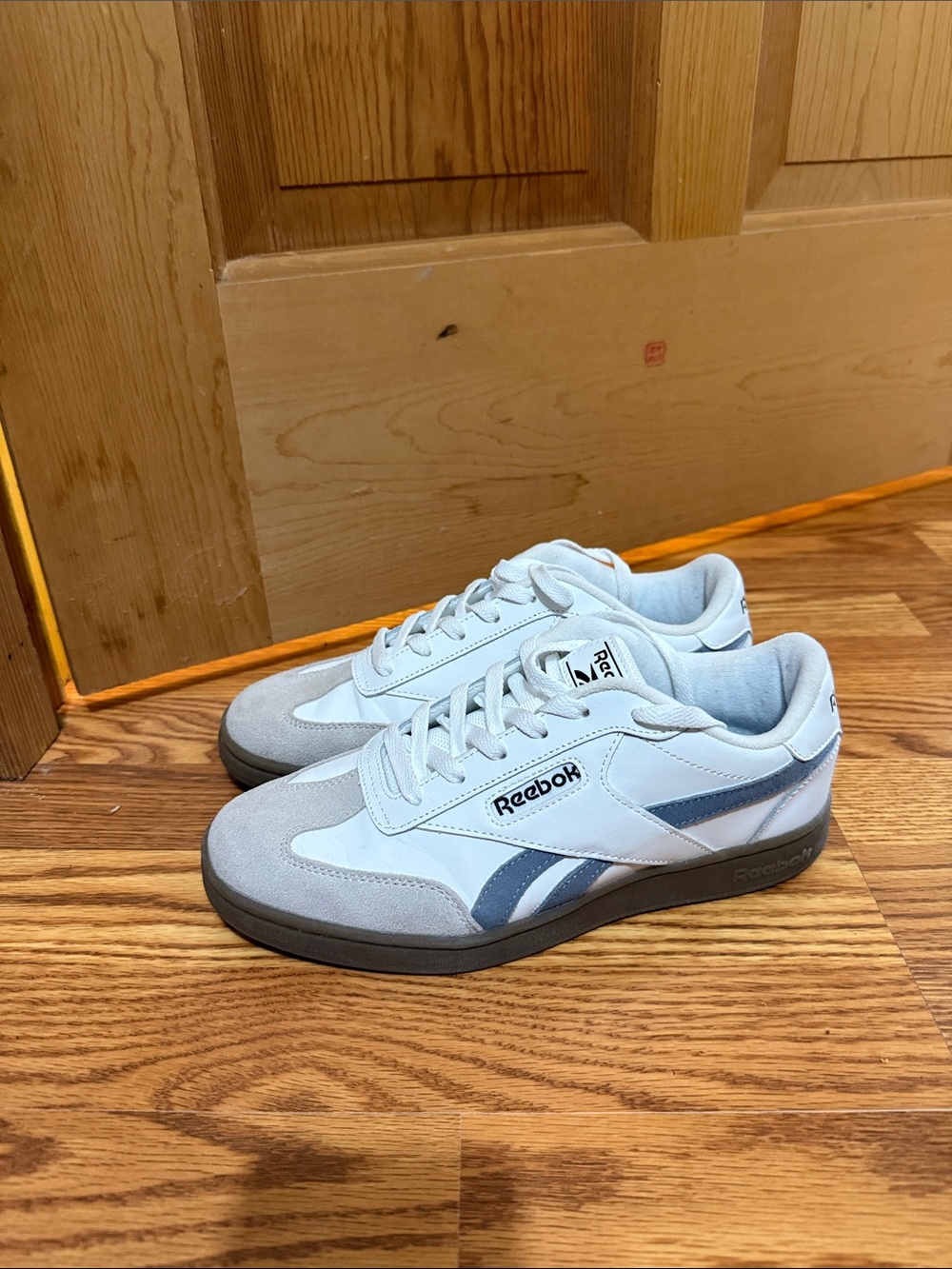 Reebok Women’s White Sneakers with Blue Accents